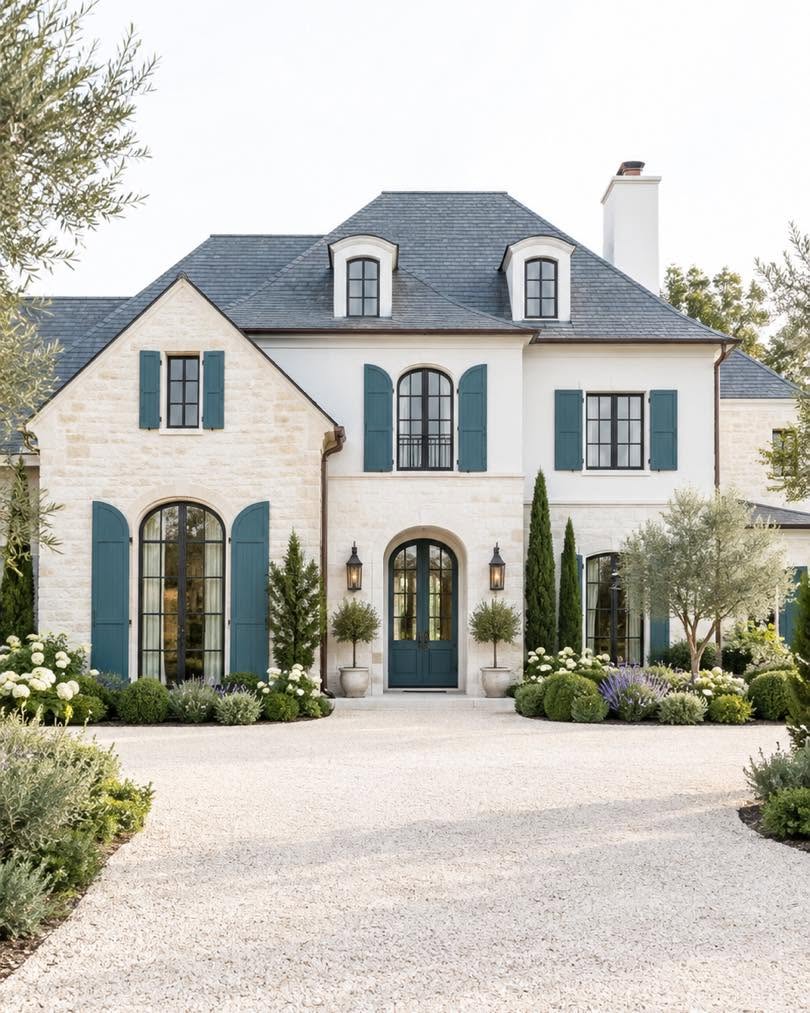 French home with blue shutters
